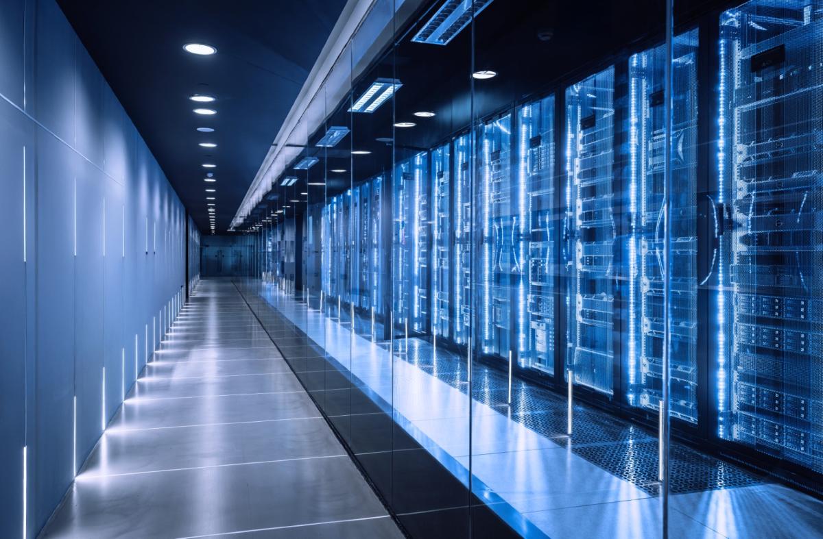 Modern data centre server room with illuminated server racks and LED lighting